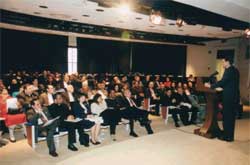 Deputy Director of the Faith-Based Initiative Bruce Eberly briefs inner city group in White House complex auditorium.